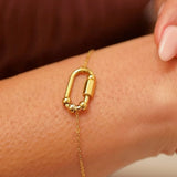 pulseira giratória dourada com 4 contas