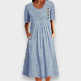 Célia | Vestido midi listrado com detalhes de botões e bolsos