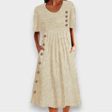 Célia | Vestido midi listrado com detalhes de botões e bolsos
