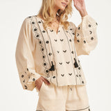 Off White Blouse Met Zwarte Borduursels En Strikkoord | Off White - Black