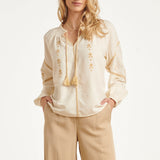 Off White Blouse Met Gouden Borduursels En Koorddetail | Off White - Sand