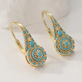 Brincos de flor turquesa banhados a ouro