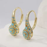 Brincos de flor turquesa banhados a ouro