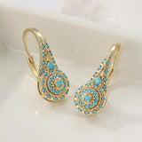 Brincos de flor turquesa banhados a ouro